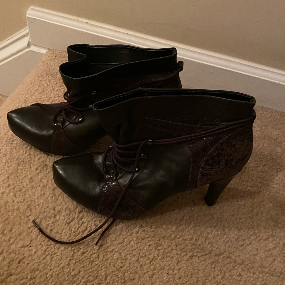 Boot is dark brown leather and suede